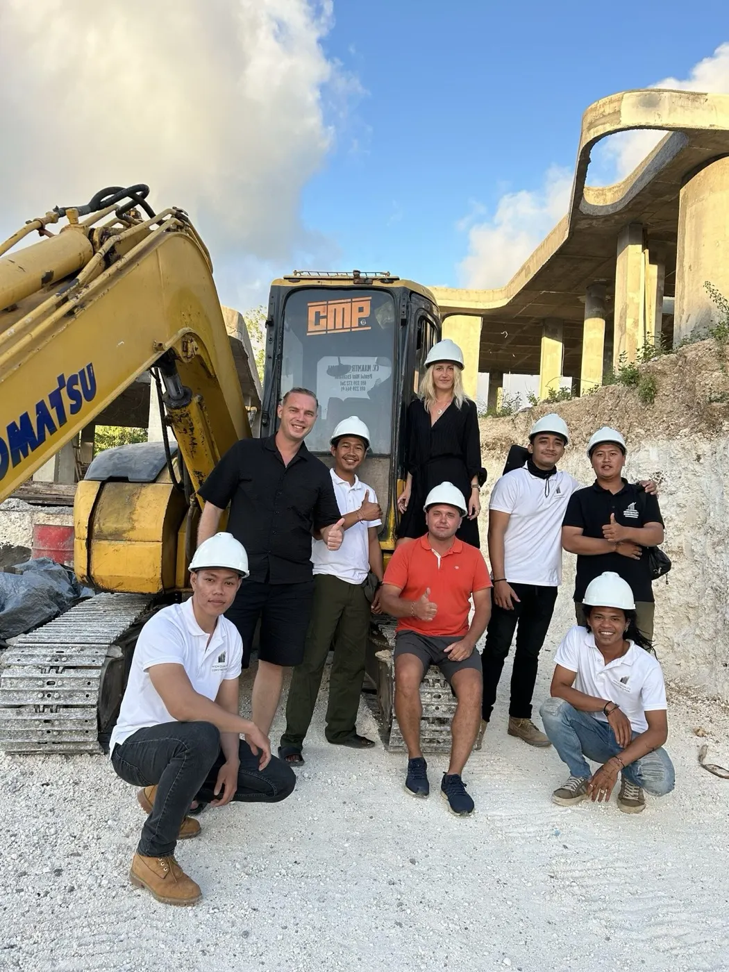 The HQC leadership with the site crew in front of the Ardhana build
