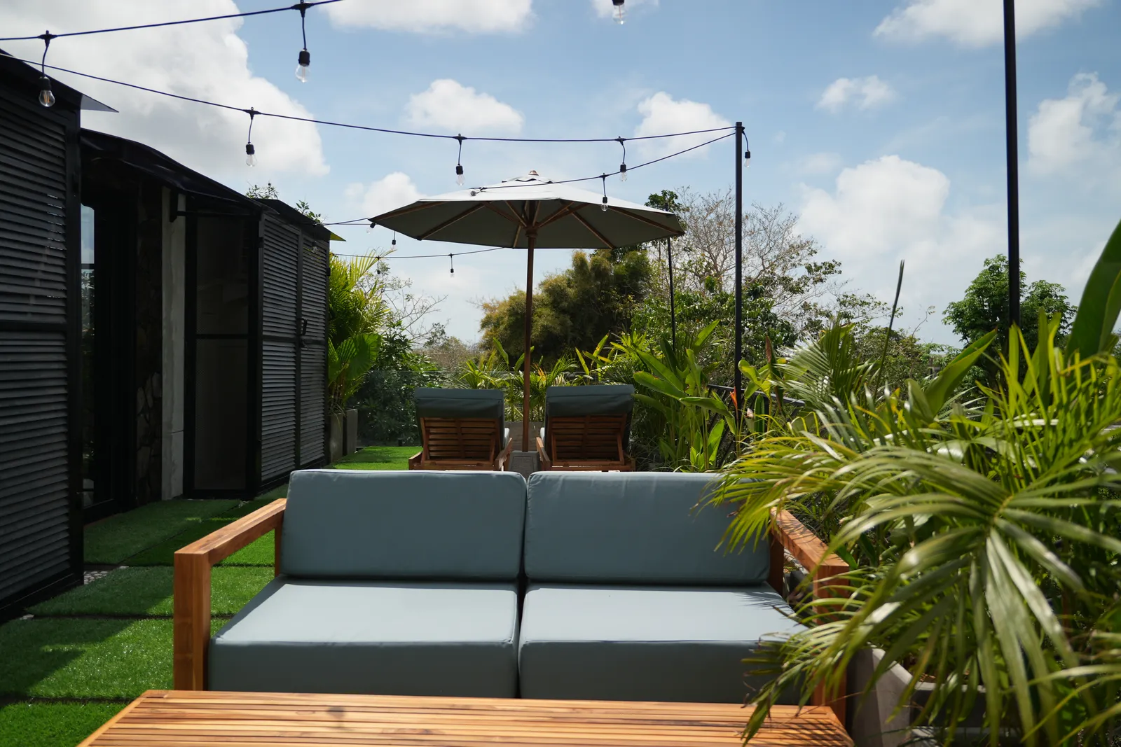 Black Rock rooftop lounge with sofa and umbrella