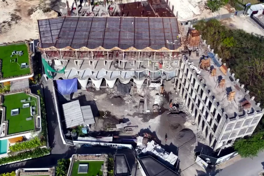 Ardhana boutique hotel frame beside the completed villas, from the August 2026 site report