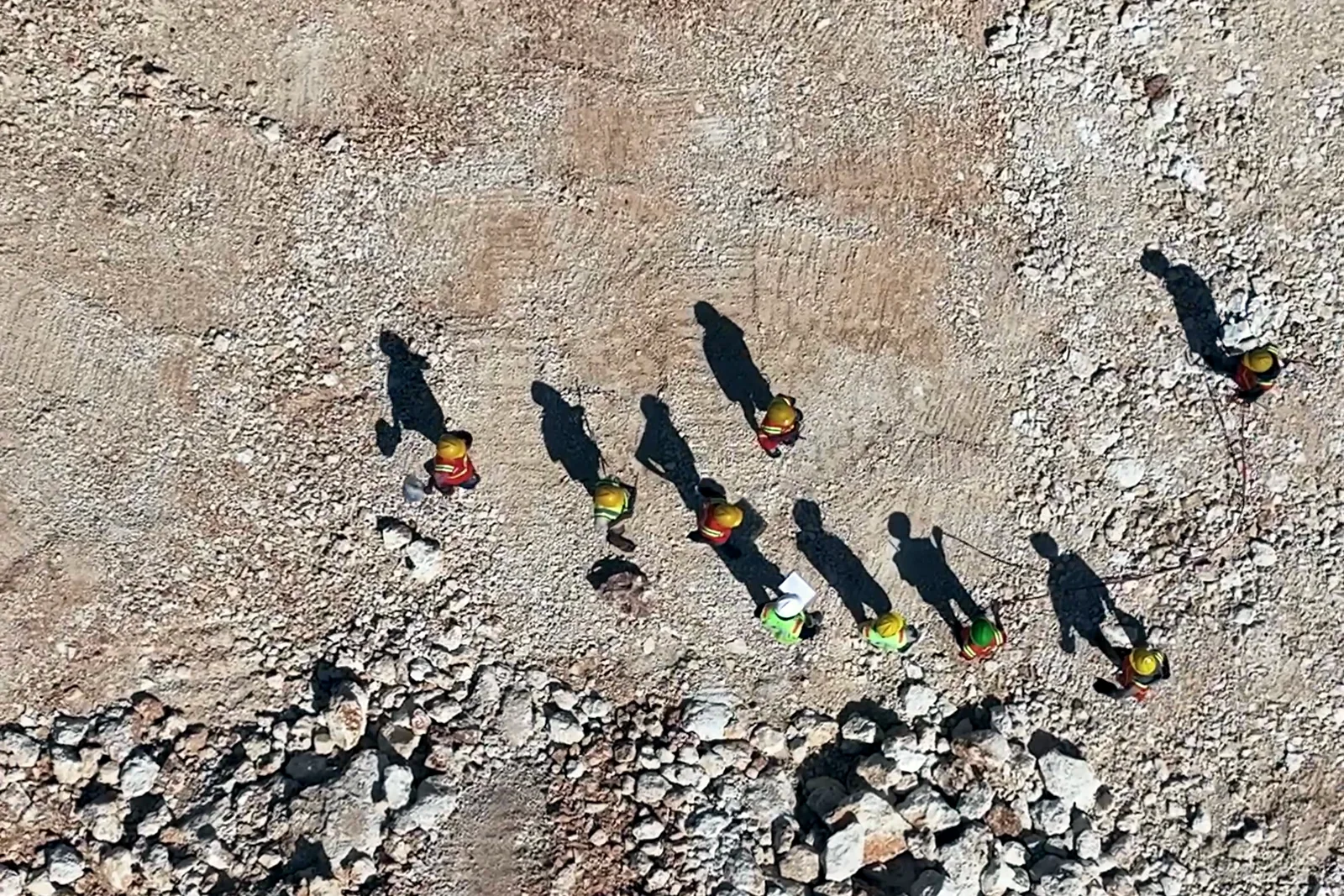 Bloom construction pit with the site crew, from the August 2026 site report