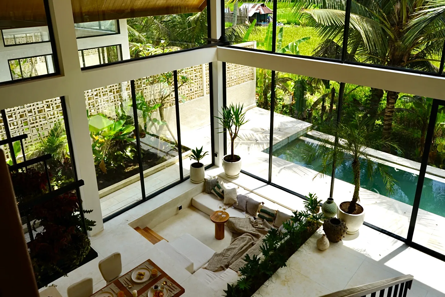 Dzen mezzanine view over living room and pool