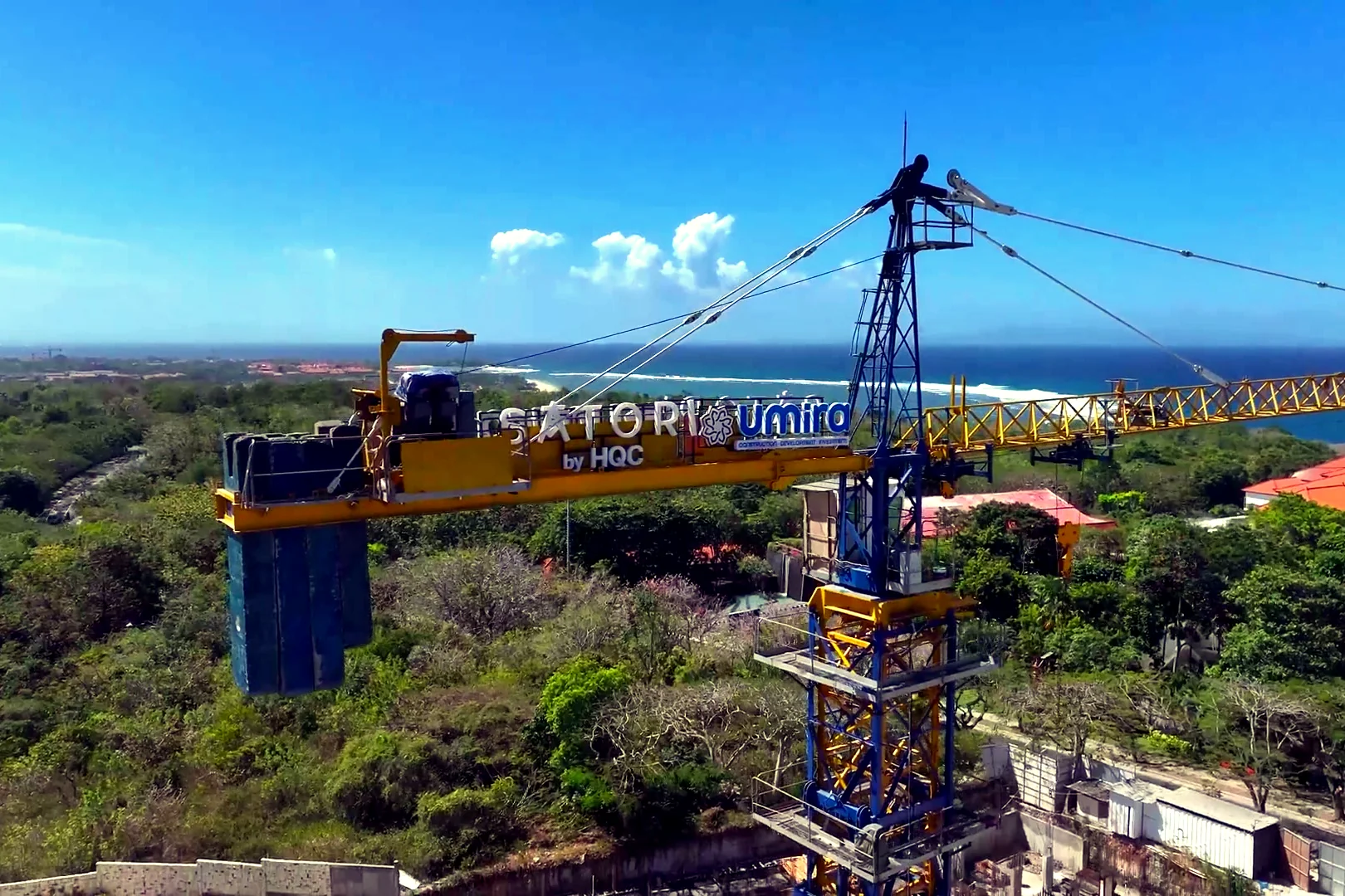 Satori construction crane above the Nusa Dua coast, photographed from the HQC drone flyover
